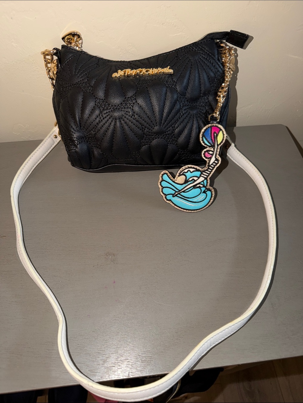 Stylish Black Quilted Crossbody Bag with White Strap